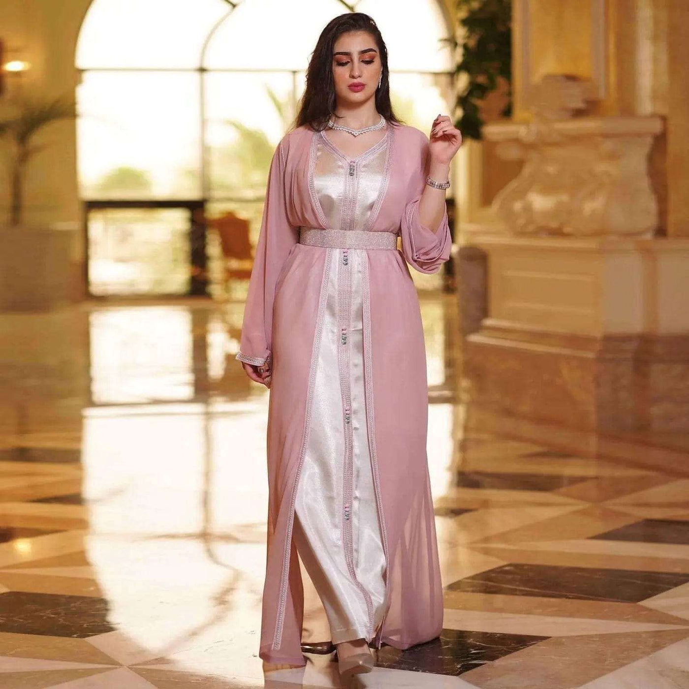 a woman wearing the pink chiffon arabian women's dress full length view
