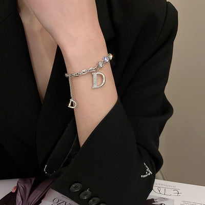BROOCHITON Bracelets a women with black dress wearing a Silver Diamond Letter D Fringe Chain Bracelet