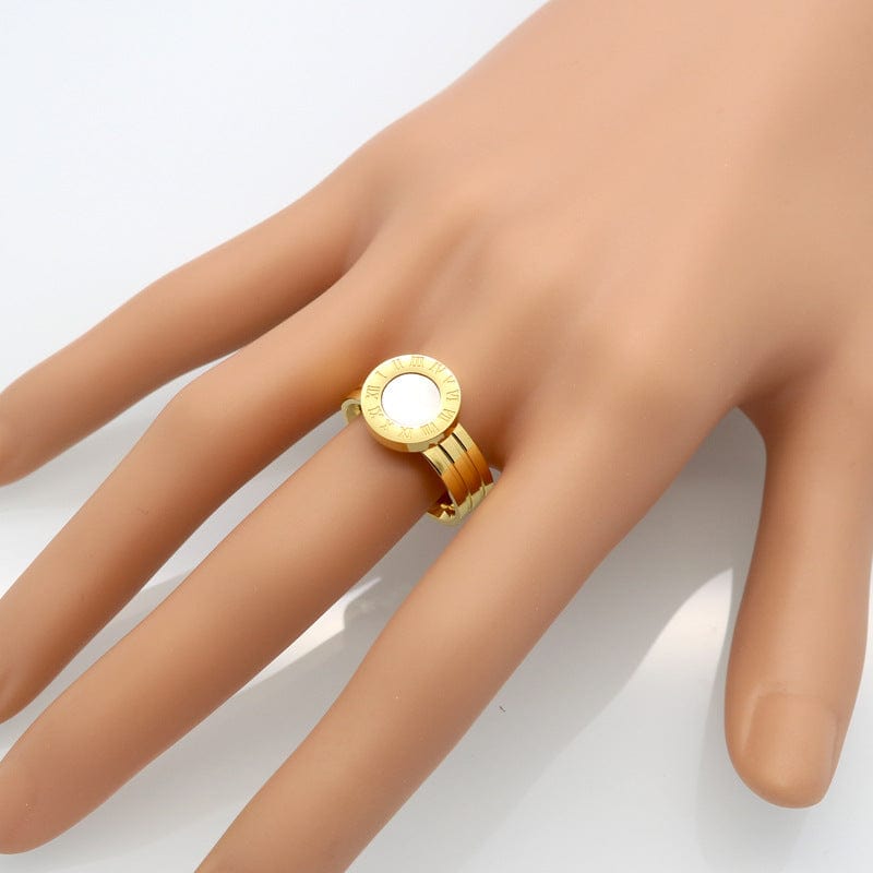 golden color ring on a middle finger of a mankan hand