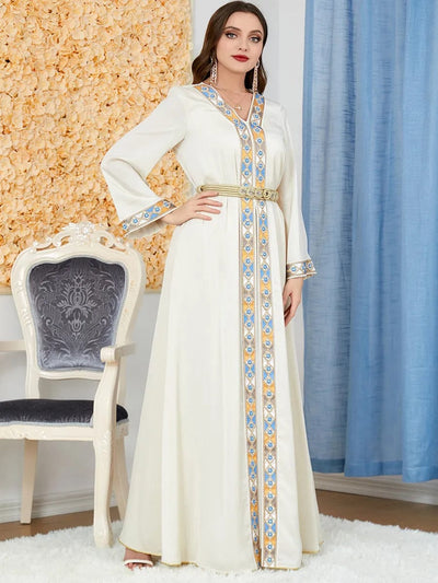 a woman wearing a Beige women's arabian dress slit v-neck full length profile view