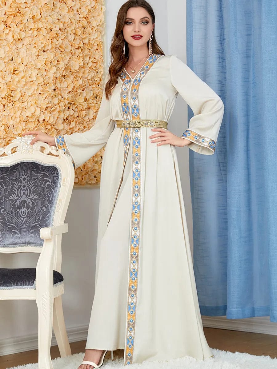 a woman wearing a Beige women's arabian dress slit v-neck full length view