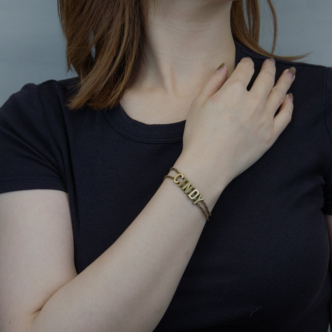 A woman wearing Cindy Personalized Name Bracelet 