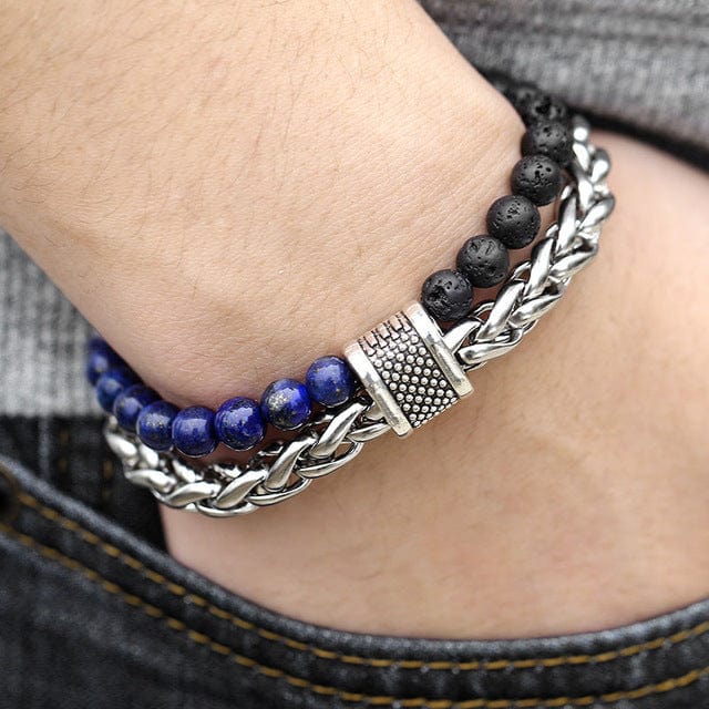 a man hand in jeans pocket wearing a double band bracelet black and blue beads