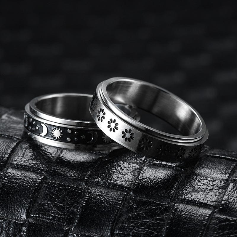 2 BROOCHITON Ring Stainless Steel Rotatable Spinner Ring  on a black leather 