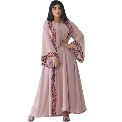 a woman wearing women's fashion embroidery v-neck dress full length view without scarf on a white backgroung
