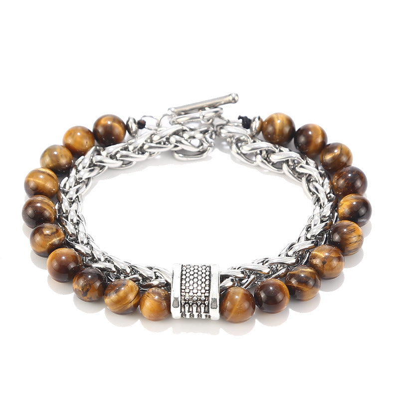 Bracelet with brown beads and silver chain on a white background