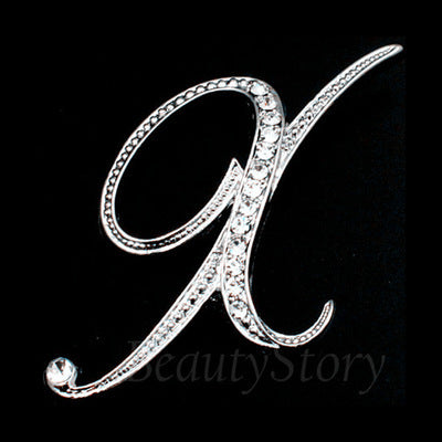Silver brooch with a decorative letter &
