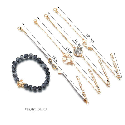 Set of gold bracelets  and a beaded bracelet on a white background with dimensions