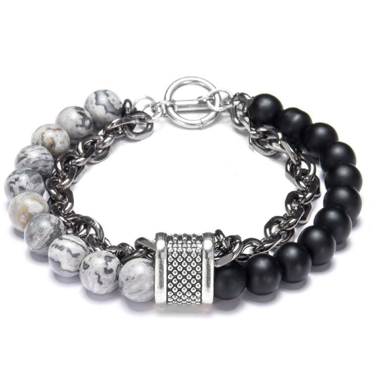 Bracelet with black and white beads on a white background