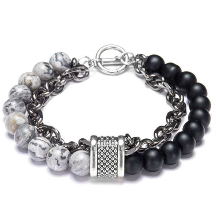 Bracelet with black and white beads on a white background
