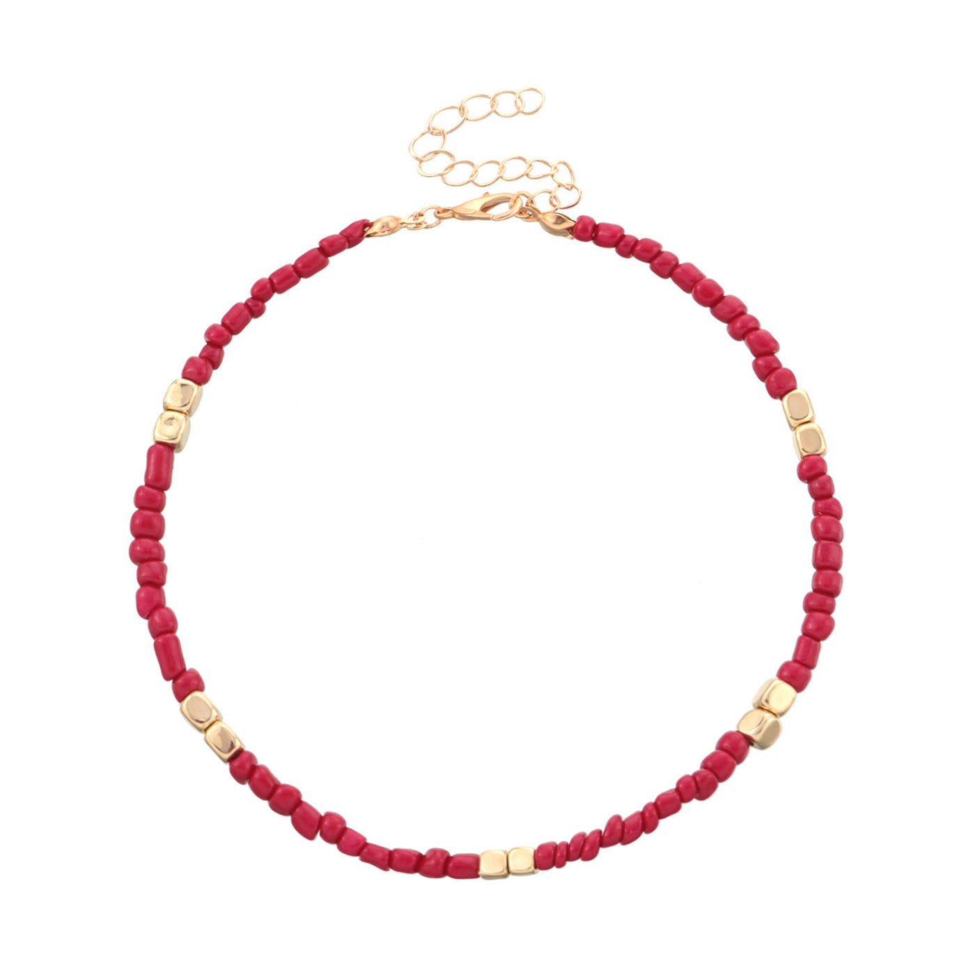 anklet with red beads and gold accents on a white background