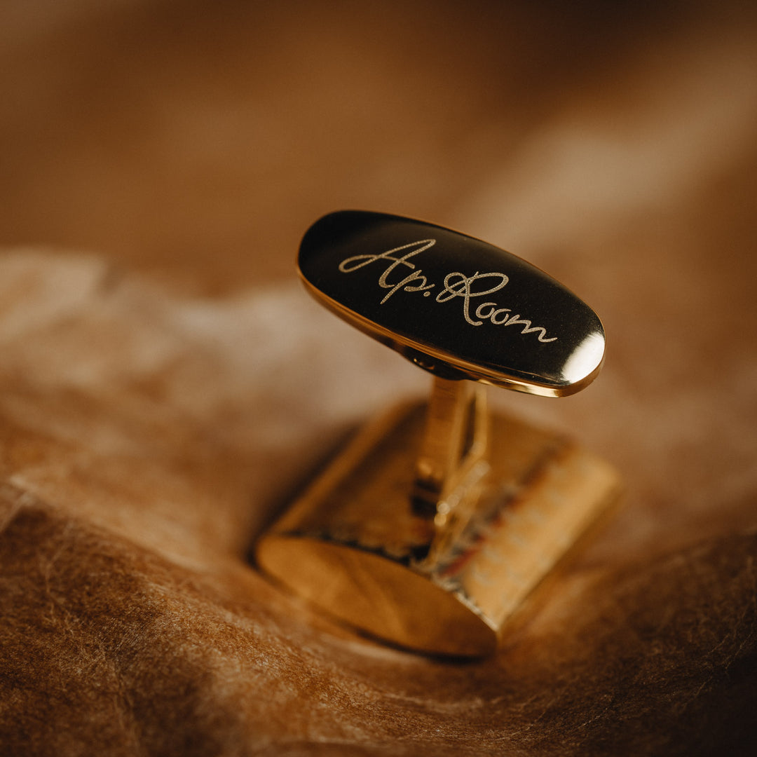 Gold and black cufflink  with &