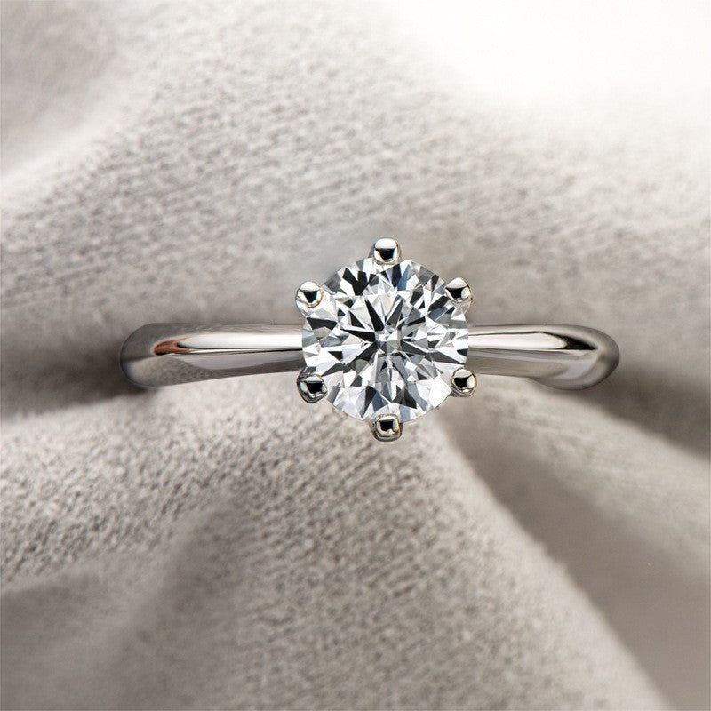 Diamond ring on a soft fabric background