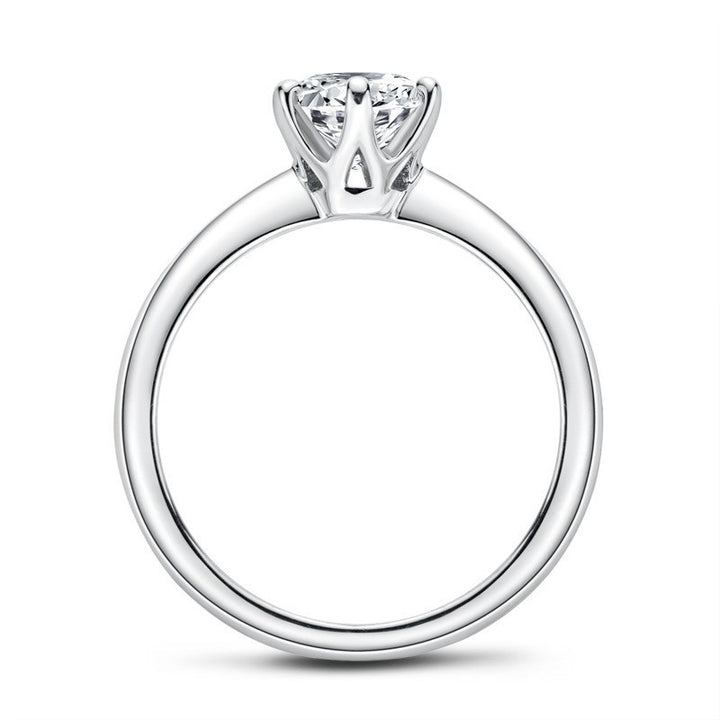 Silver ring with a diamond on a white background