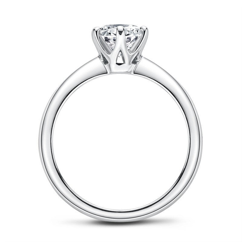 Silver ring with a diamond on a white background