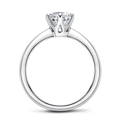 Silver ring with a diamond on a white background