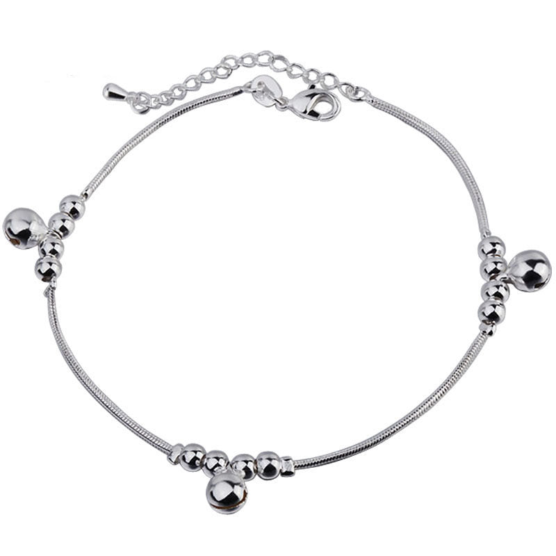 Silver bracelet with beads on a white background