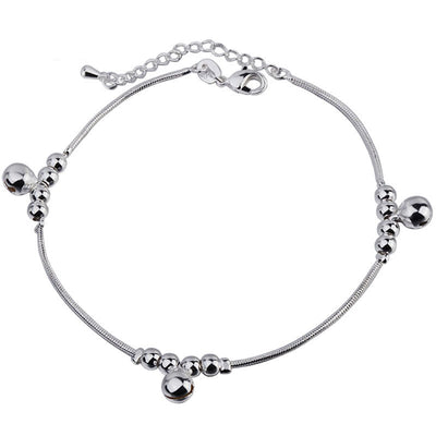 Silver bracelet with beads on a white background