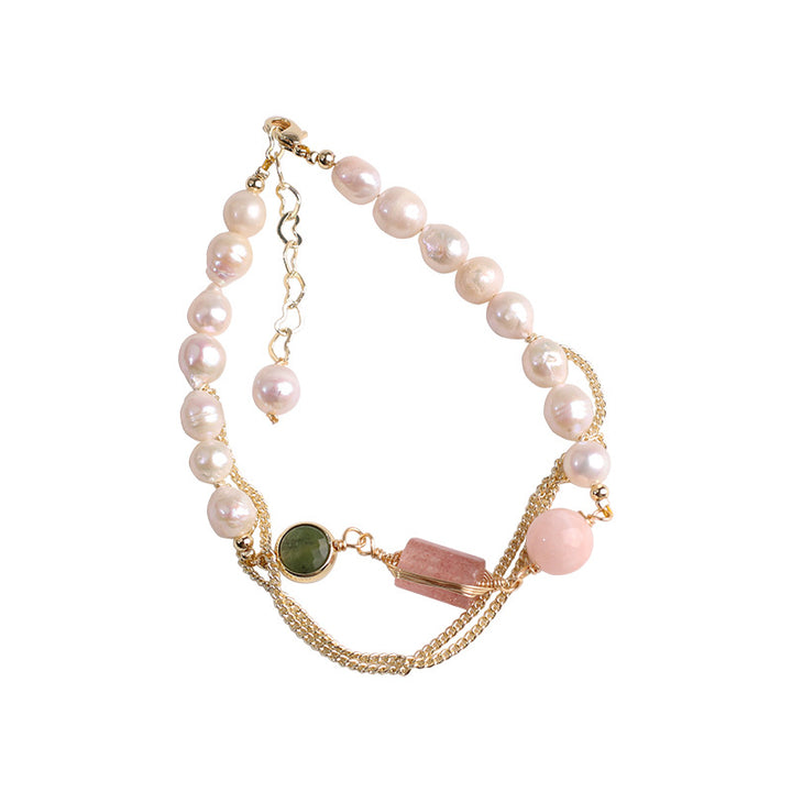 Multistrand bracelet with pearls and gemstones on a white background