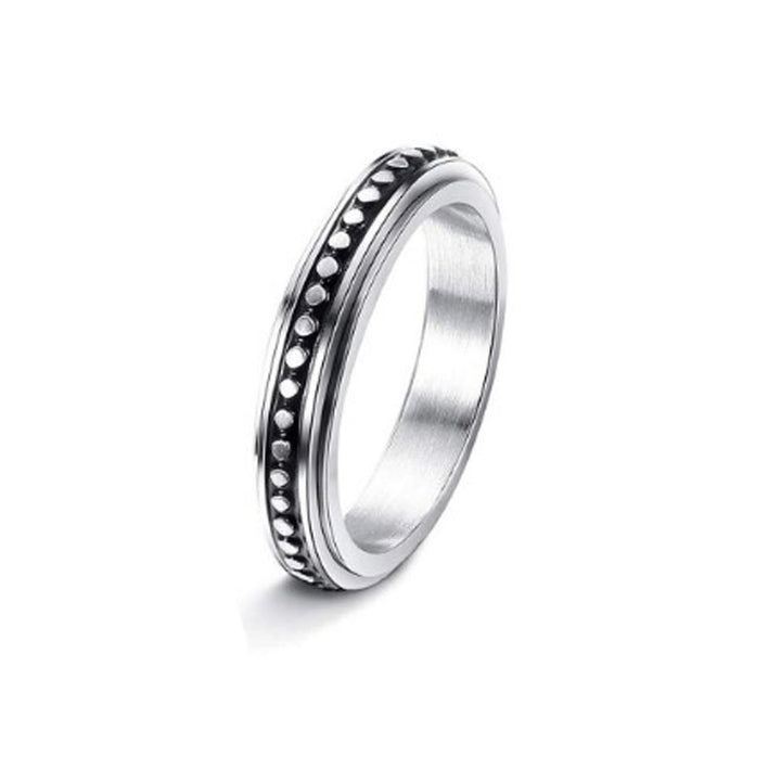 Silver ring with a textured band on a white background