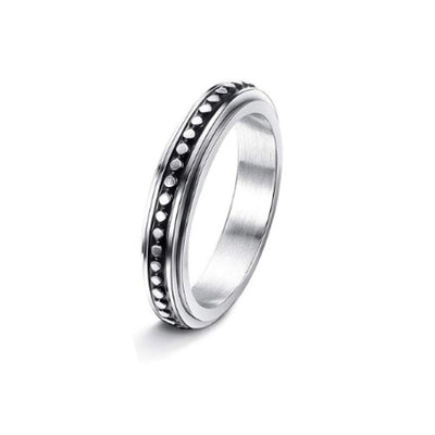 Silver ring with a textured band on a white background