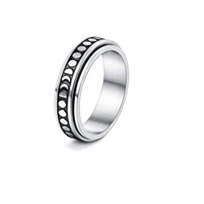 Silver ring of moon phases with a black interior on a white background