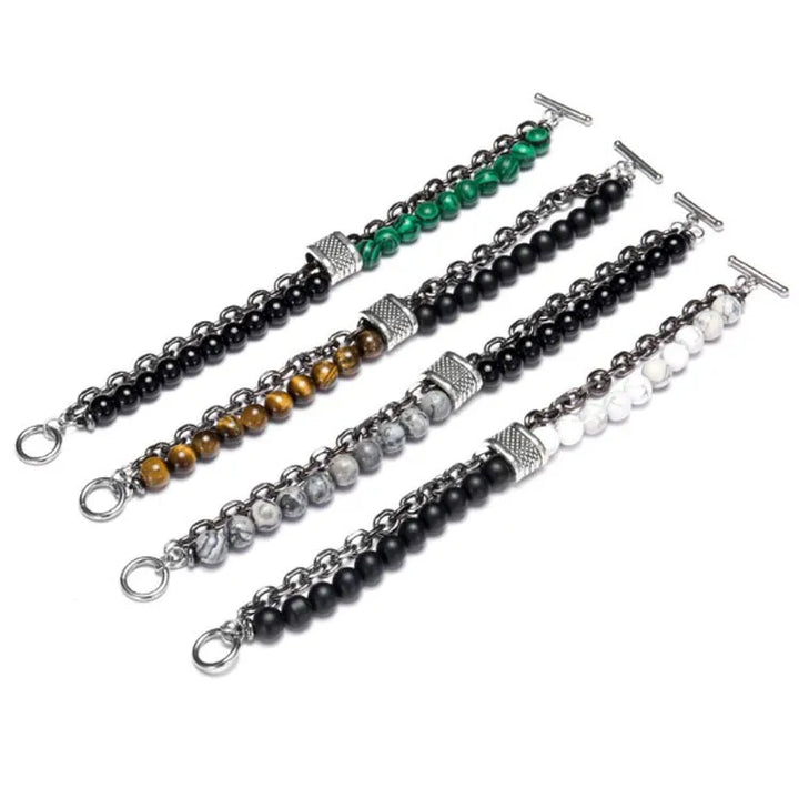 Set of four beaded bracelets with different color schemes on a white background