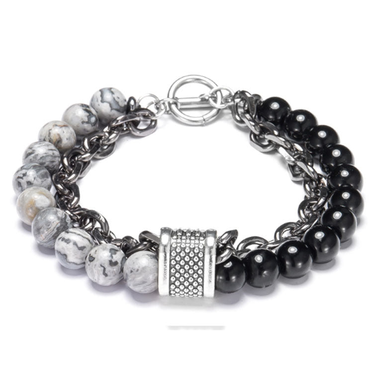 Multistrand bracelet with beads and a metal clasp on a white background