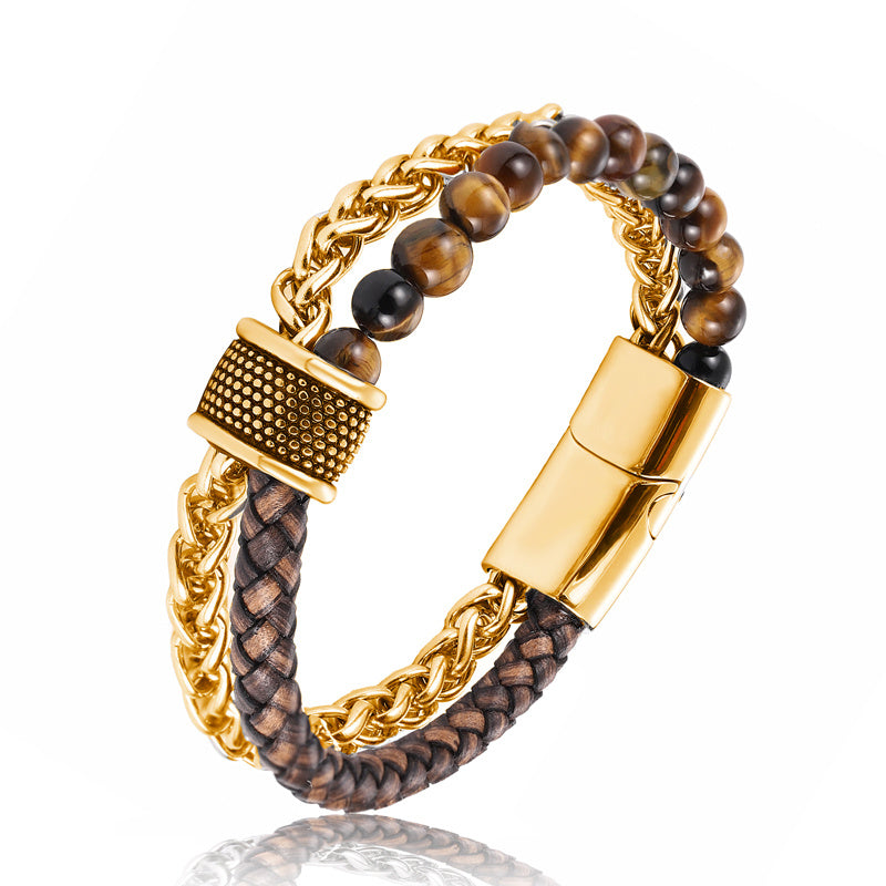 Bracelet with gold chain and brown beads on a white background