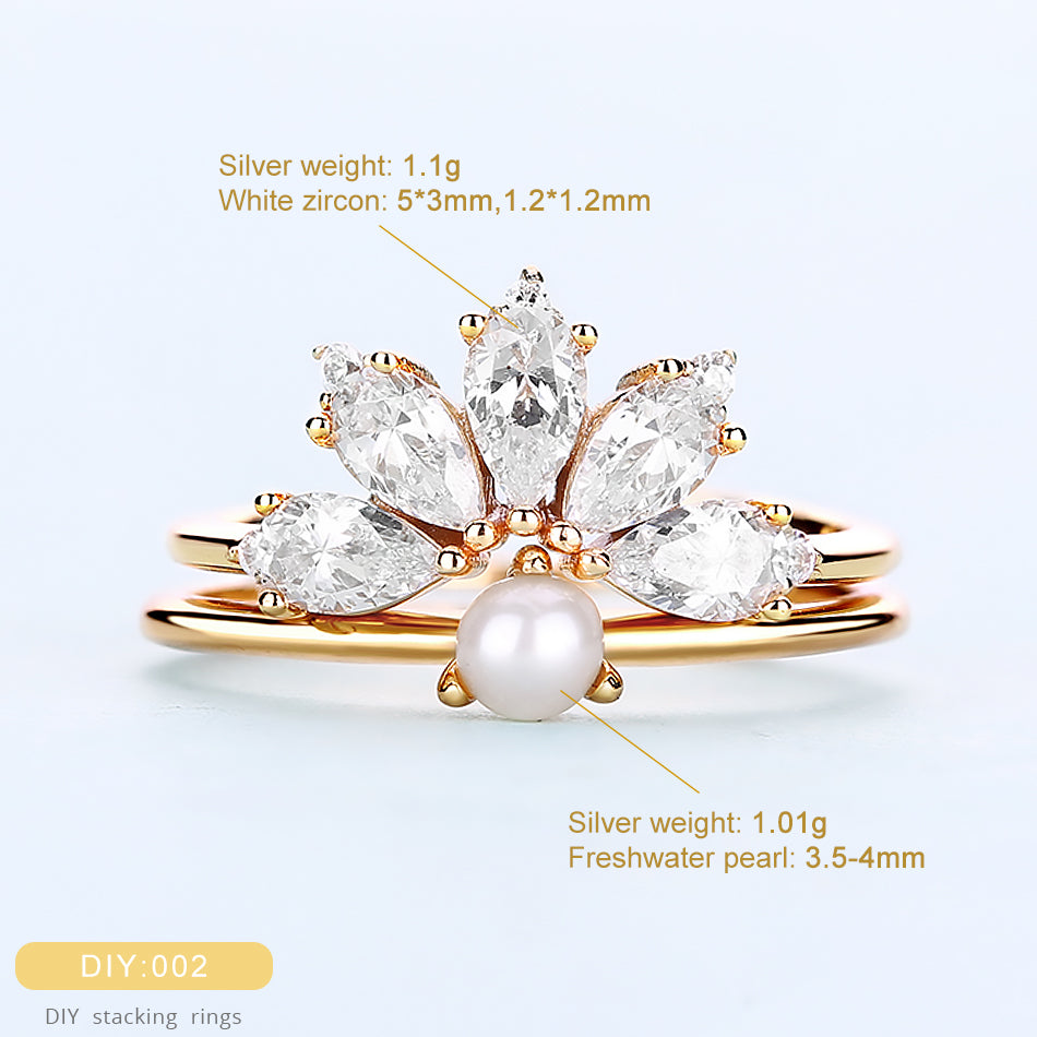 Gold ring with white zircon and pearl on a light blue background