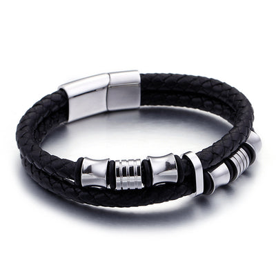 Black braided leather bracelet with silver metal accents on a white background