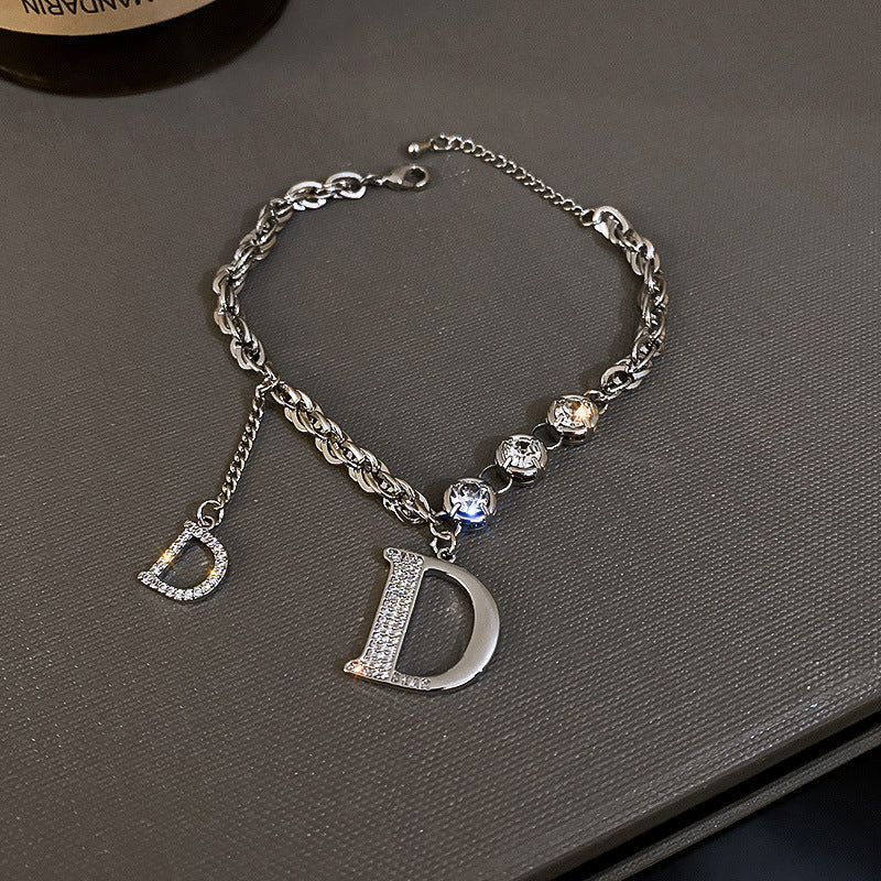 Silver bracelet with letter &