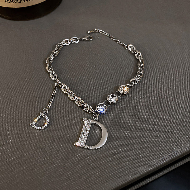 Silver bracelet with letter &