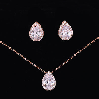 Jewelry set with teardrop-shaped earrings and necklace on a black background
