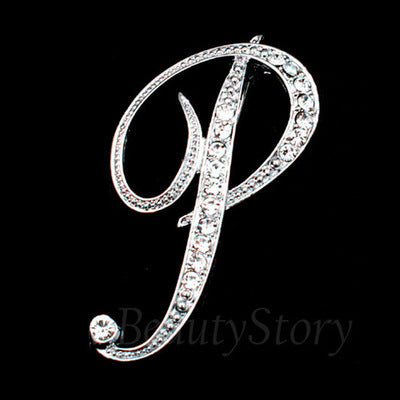 Silver brooch with letter &