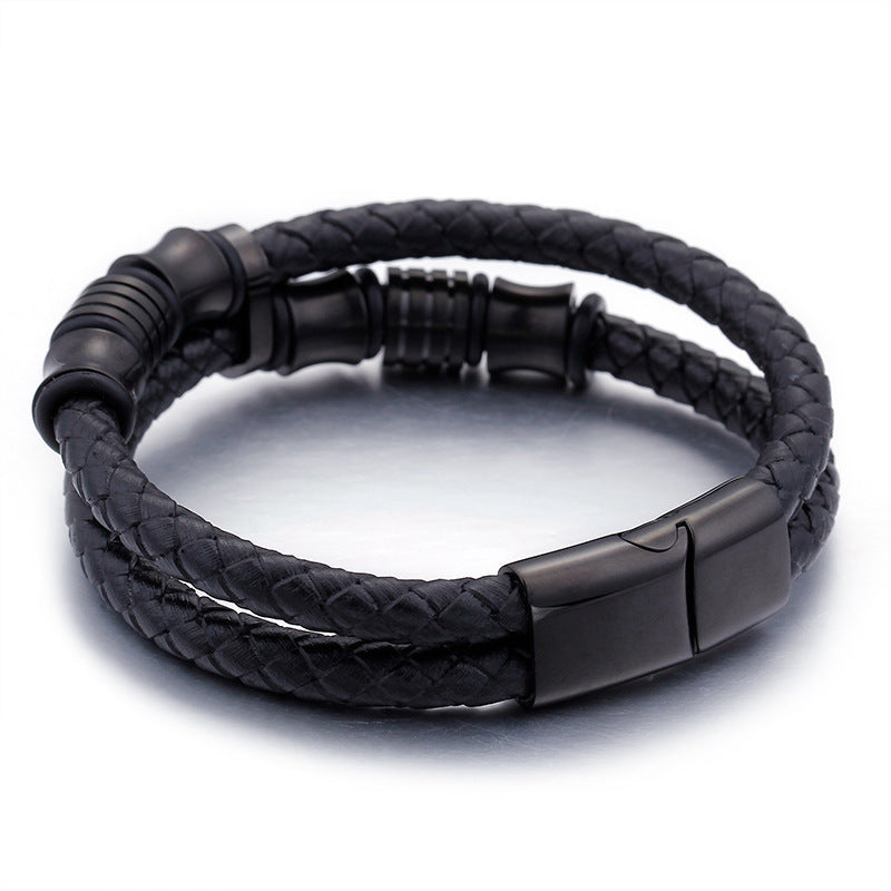 Black braided leather bracelet with a metal clasp on a white background