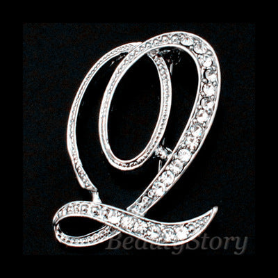 Silver brooch with a letter &
