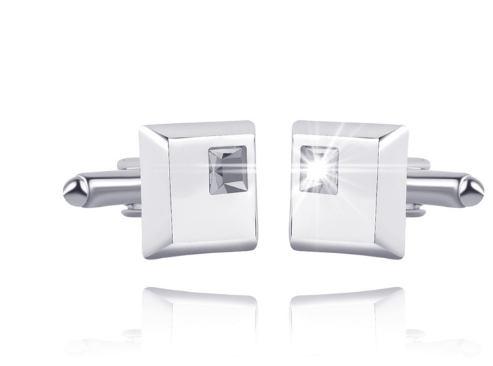 Pair of silver square cufflinks with clear gemstones on a white background