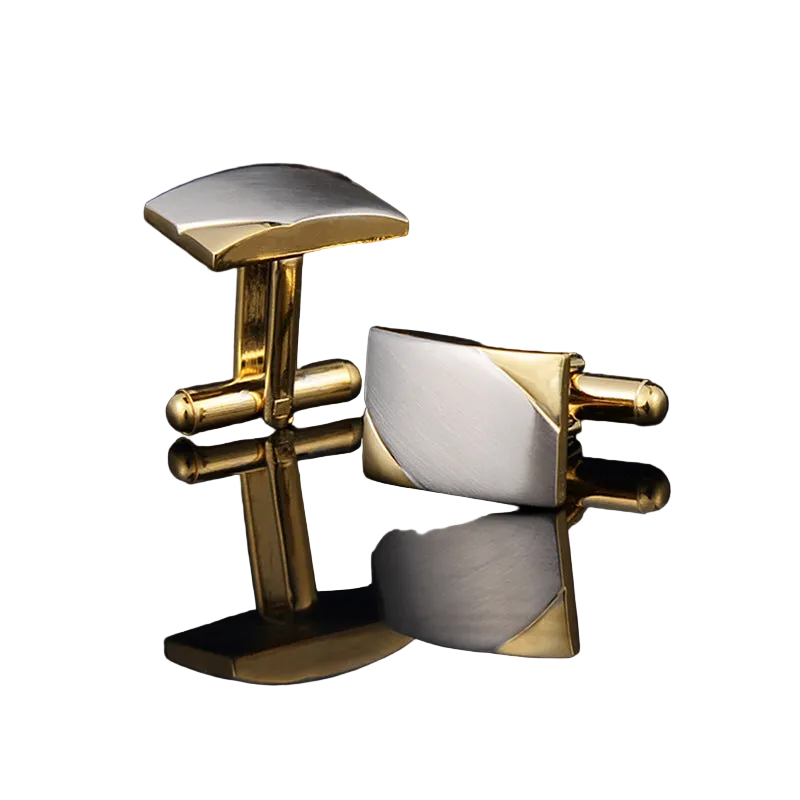 Gold and silver cufflinks on a black background