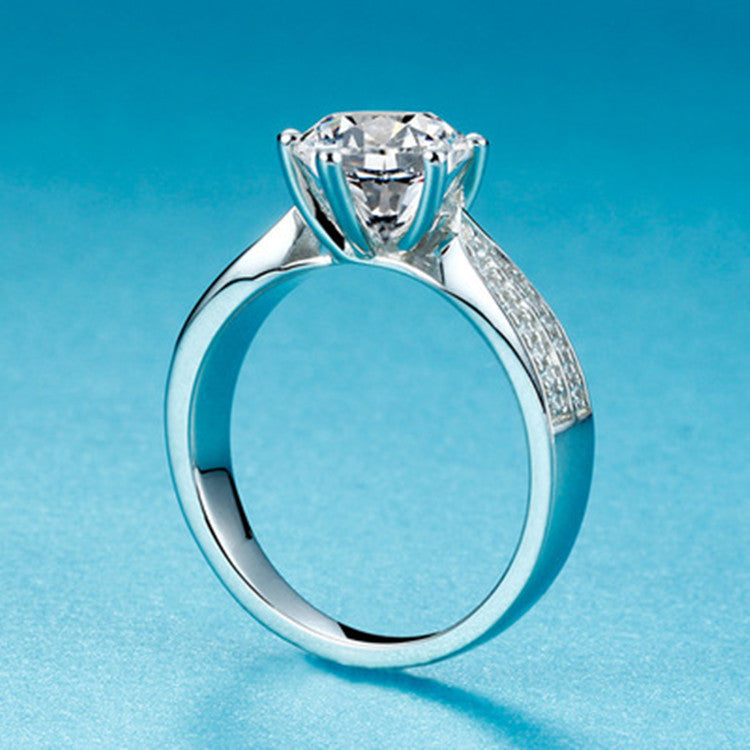 cubic zirconia ring on a light blue background