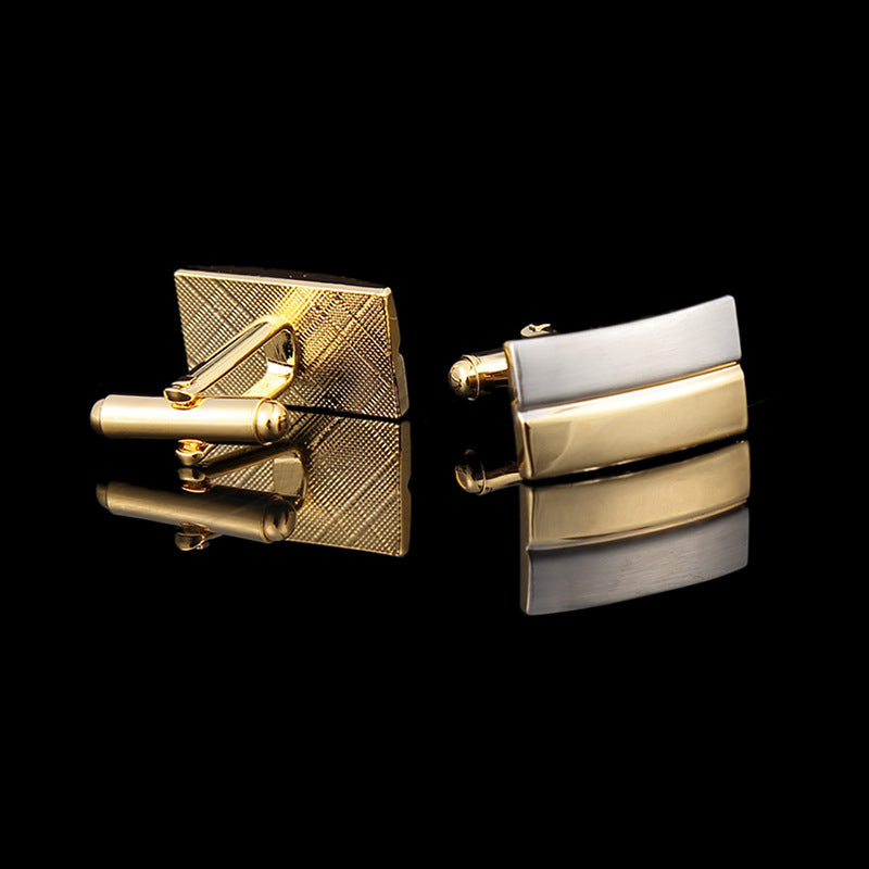 Gold and silver square cufflinks on a black background