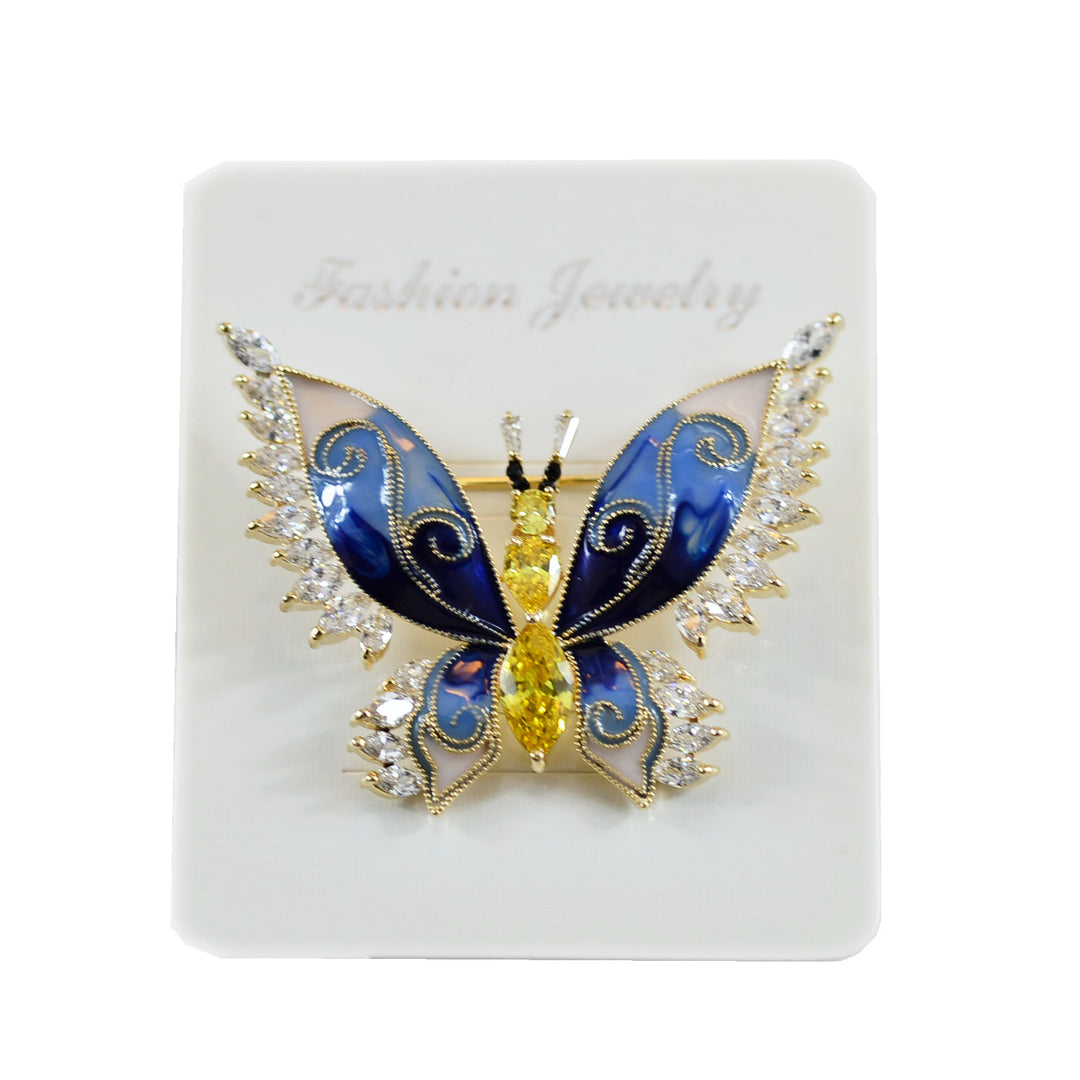Butterfly-shaped jewelry on a white card with &