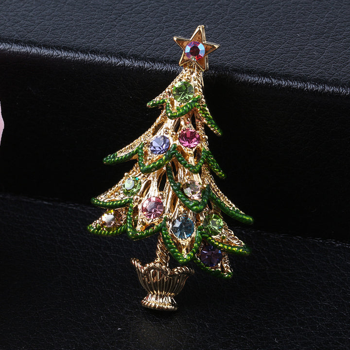Decorative Christmas tree brooch with gemstones on a black background
