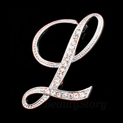 Silver brooch with letter &