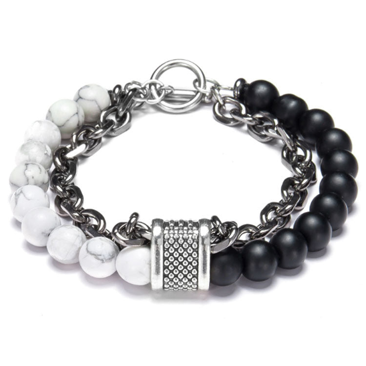Bracelet with black and white beads on a silver chain