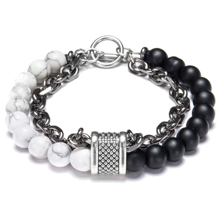 Bracelet with black and white beads on a silver chain