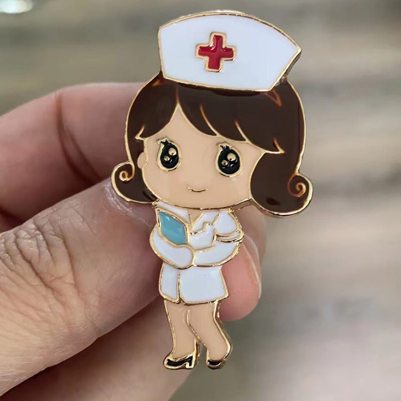 Cartoon nurse pin held between fingers with a blurred background