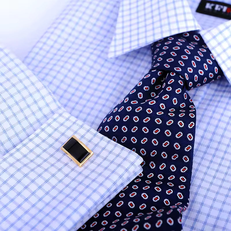 Close-up of a blue checkered shirt with a patterned tie and cufflinks.