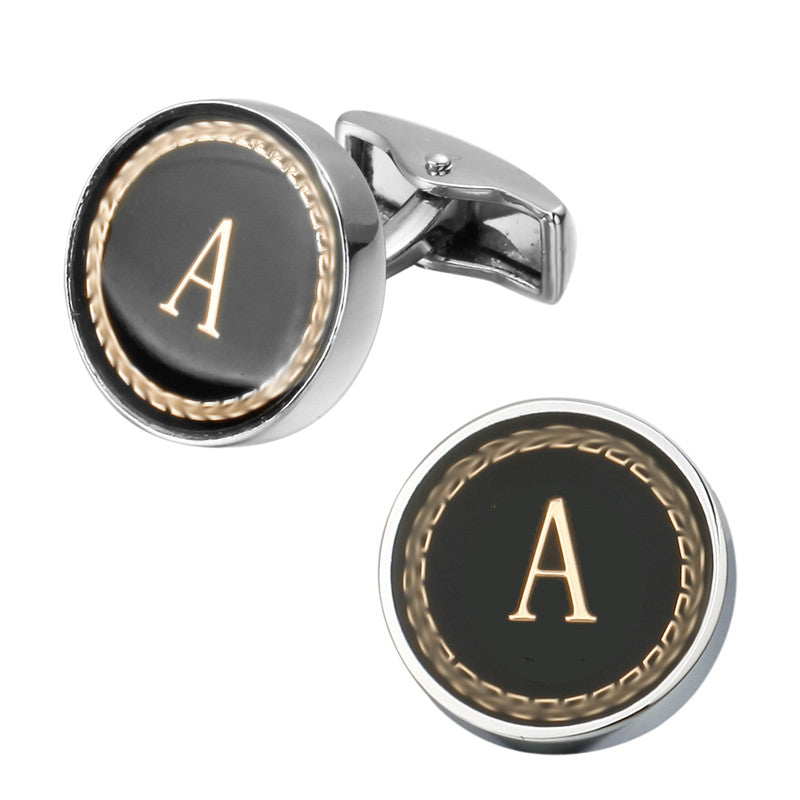 Cufflinks with black round faces featuring gold letter &