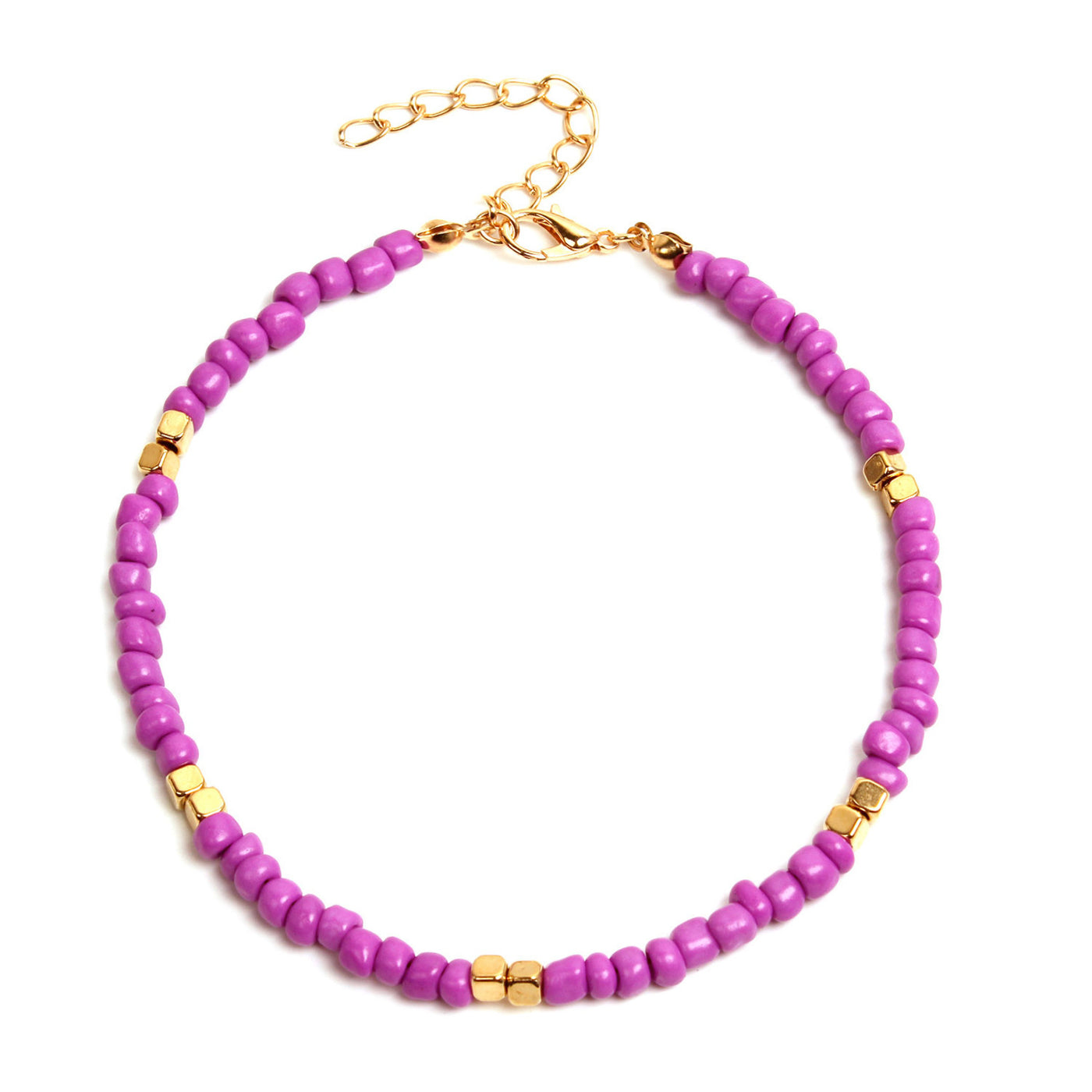 Pink beaded anklet with gold accents on a white background